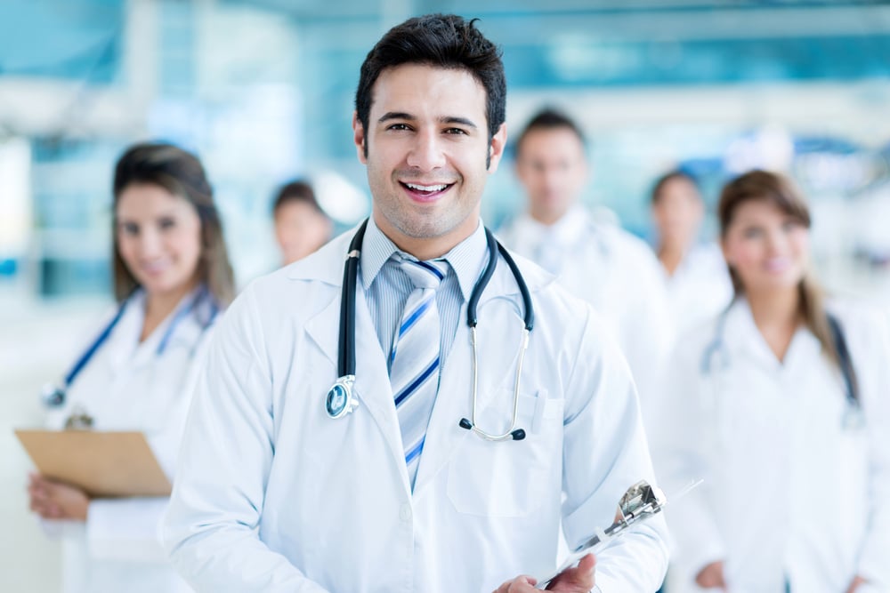 Male doctor leading his medical team at the hospital